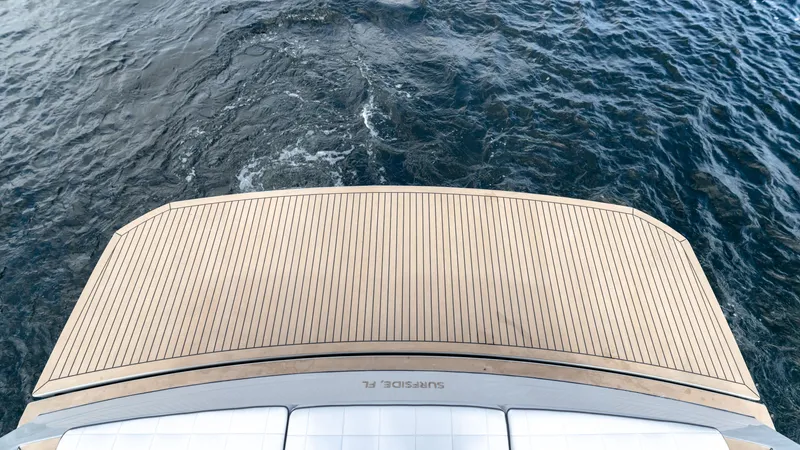 Slide: The Image of 2024 Pardo Yachts 43, elegant teak deck, cruising on open water. - 13