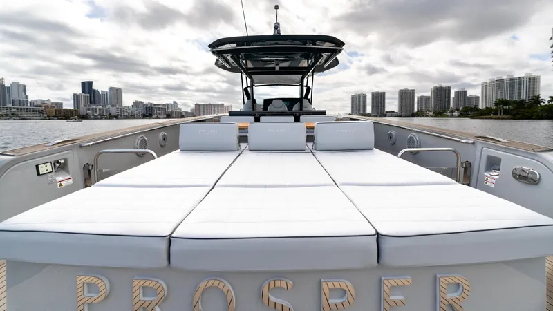Slide: The Image of 2024 Pardo Yachts 43 with sunbathing deck, city skyline in background. - 15
