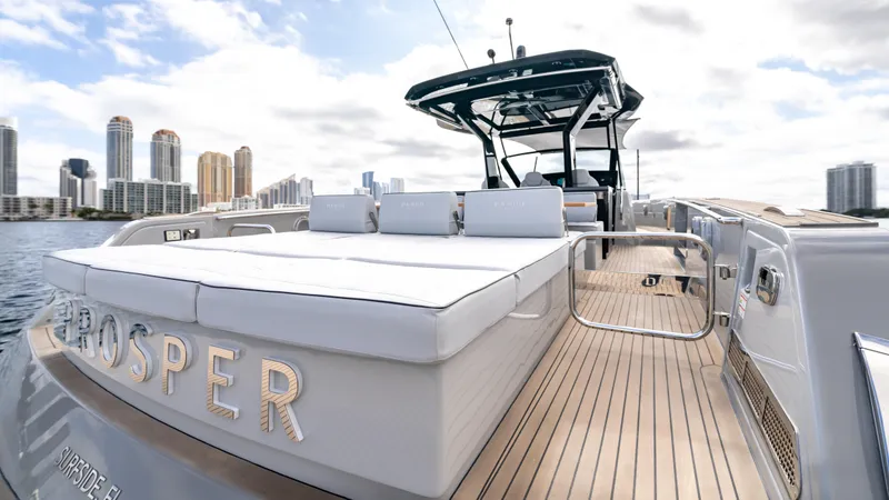 Slide: The Image of 2024 Pardo Yachts 43 luxury yacht with sun deck, city skyline in background. - 17