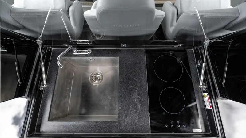 Slide: The Image of 2024 Pardo Yachts 43 kitchen area with sink and induction cooktop. - 27