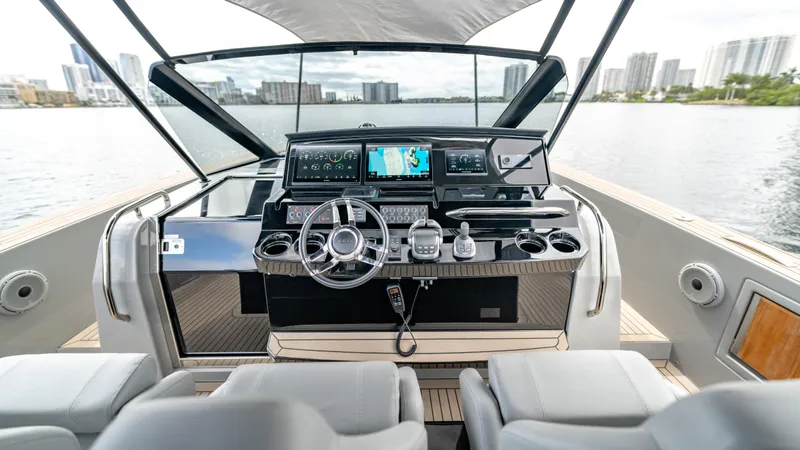 Slide: The Image of 2024 Pardo Yachts 43 helm with modern navigation system on open water. - 30