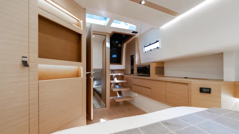 Slide: The Image of Luxurious interior of 2024 Pardo Yachts 43, featuring modern wood finishes and skylight. - 37