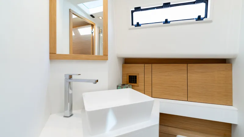 Slide: The Image of Modern bathroom interior of 2024 Pardo Yachts 43, featuring sleek sink and wooden cabinetry. - 44