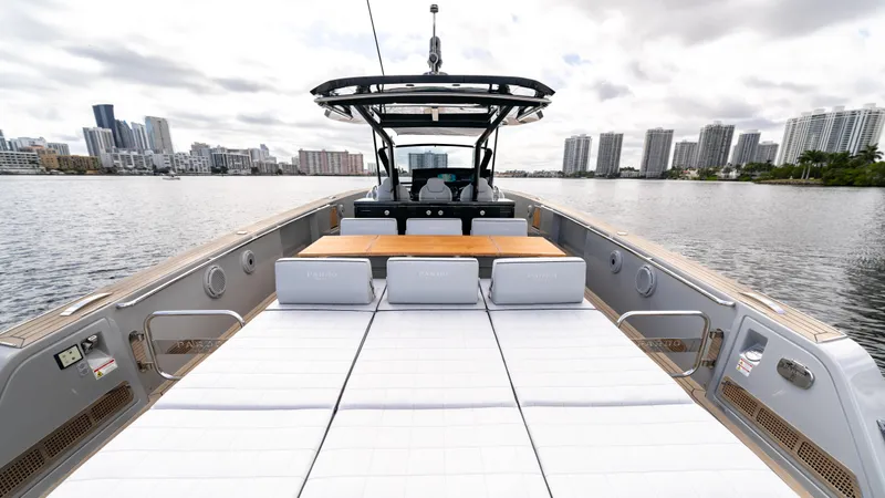 Slide: The Image of 2024 Pardo Yachts 43 on water, city skyline in background, luxury deck view. - 16