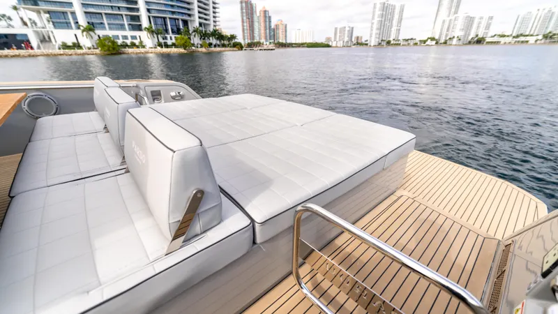 Slide: The Image of 2024 Pardo Yachts 43 with luxurious deck seating, overlooking a waterfront cityscape. - 20