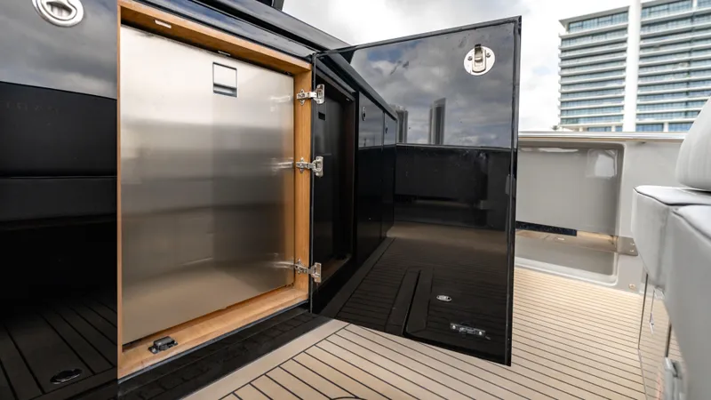 Slide: The Image of Open storage compartment on 2024 Pardo Yachts 43, featuring sleek black finish and modern design. - 28