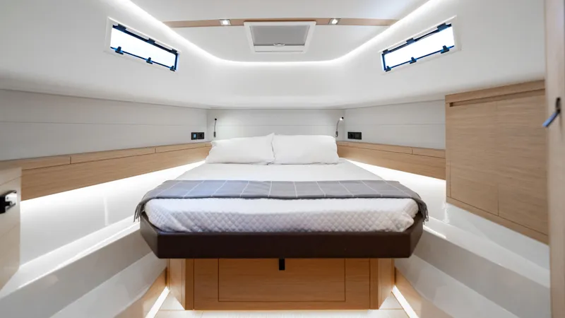 Slide: The Image of Luxurious interior cabin of 2024 Pardo Yachts 43, featuring modern design and cozy bedding. - 36