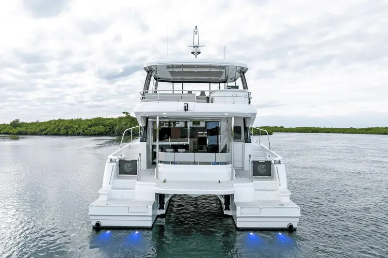 Slide: The Image of 2026 Aquila 50 Yacht on serene water, showcasing modern design and luxury features. - 10