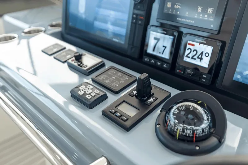 Slide: The Image of 2026 Aquila 50 Yacht dashboard with advanced navigation controls and digital displays. - 21