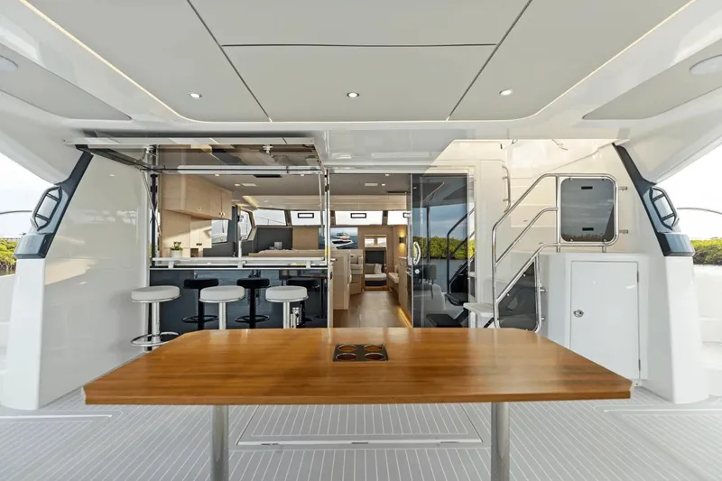 Slide: The Image of Luxurious 2026 Aquila 50 Yacht interior with modern kitchen and seating area. - 26