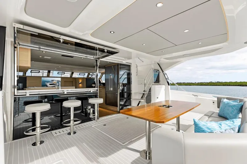 Slide: The Image of Luxurious 2026 Aquila 50 Yacht interior with modern seating and elegant design. - 28