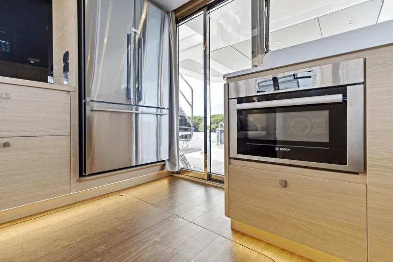 Slide: The Image of Modern kitchen interior of 2026 Aquila 50 Yacht with stainless steel appliances. - 31