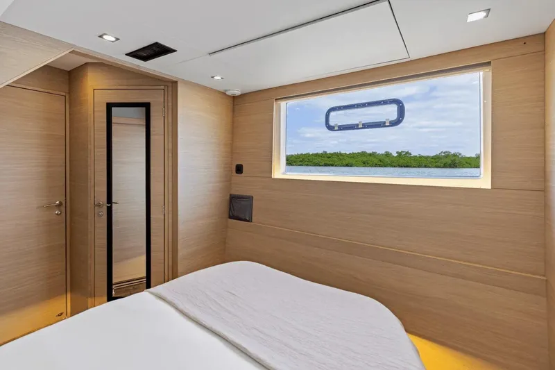 Slide: The Image of Luxurious cabin interior of 2026 Aquila 50 Yacht with scenic window view. - 38