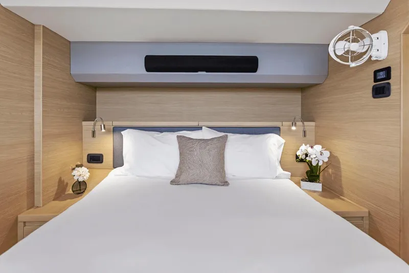 Slide: The Image of Luxurious bedroom interior of 2026 Aquila 50 Yacht with elegant decor and modern amenities. - 42