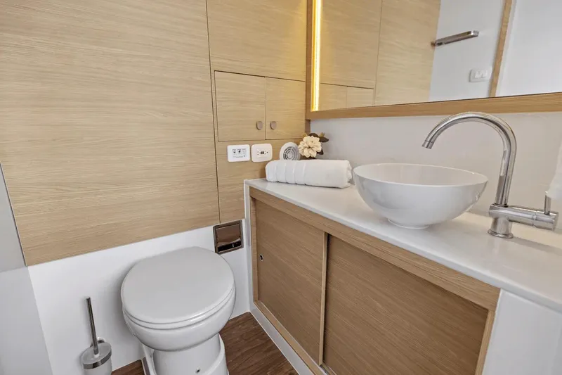 Slide: The Image of Modern bathroom in 2026 Aquila 50 Yacht with sleek fixtures and wooden cabinetry. - 47