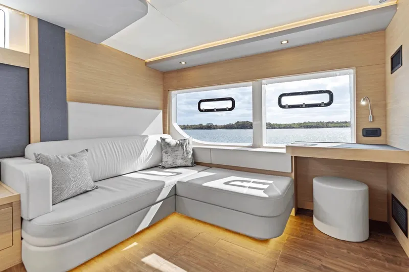 Slide: The Image of Luxurious interior of 2026 Aquila 50 Yacht with modern seating and scenic window views. - 51