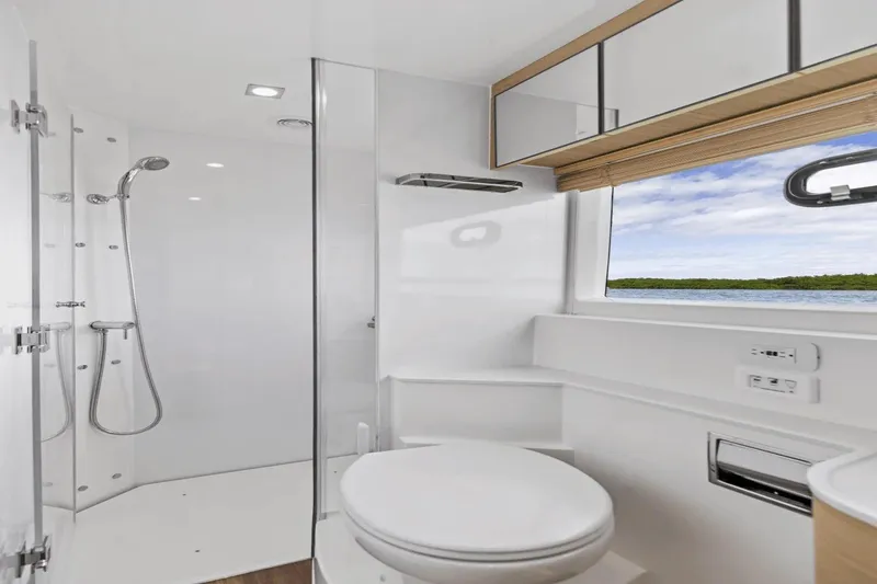 Slide: The Image of Luxurious bathroom in 2026 Aquila 50 Yacht with modern shower and scenic window view. - 52