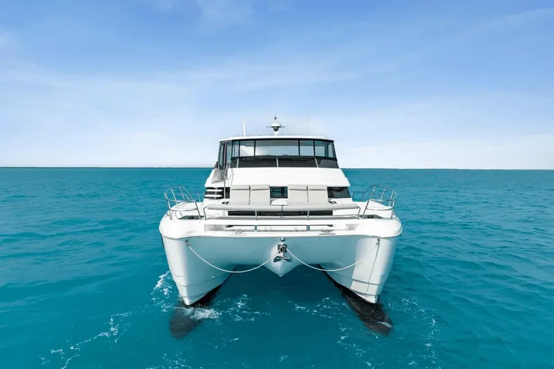 Slide: The Image of Aquila 50 Yacht 2026 cruising on clear blue ocean waters. - 6