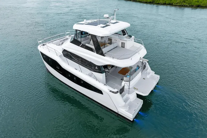 Slide: The Image of Aquila 50 Yacht 2026 cruising on calm waters, showcasing sleek design and spacious decks. - 9