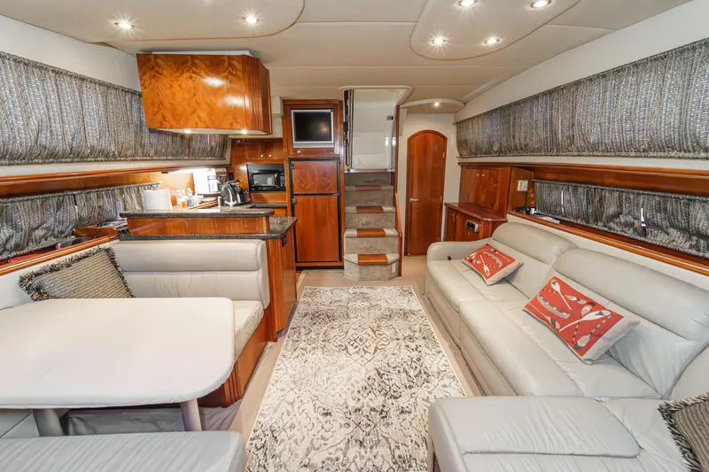 Slide: The Image of Luxurious interior of a 2006 Cruisers 415 yacht with modern furnishings and elegant decor. - 17