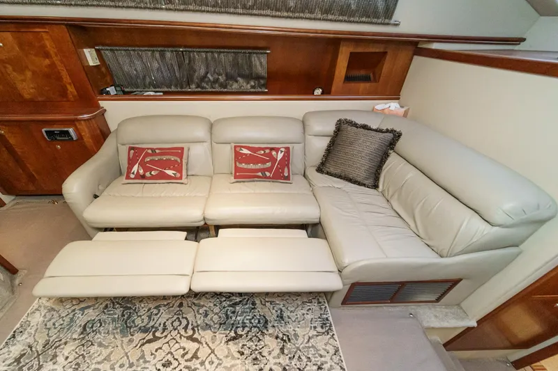 Slide: The Image of Luxurious interior of 2006 Cruisers 415 yacht with beige leather seating and decorative pillows. - 23
