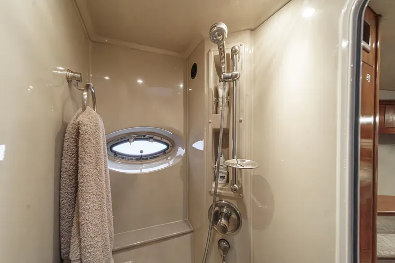 Slide: The Image of Shower area in 2006 Cruisers 415 yacht with towel and porthole window. - 29
