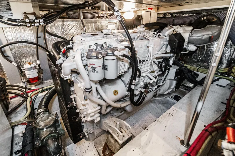 Slide: The Image of Engine room of 2006 Cruisers 415 yacht, showcasing detailed mechanical components. - 36