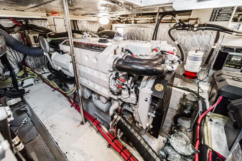 Slide: The Image of Engine room of 2006 Cruisers 415 yacht, showcasing detailed mechanical components. - 39