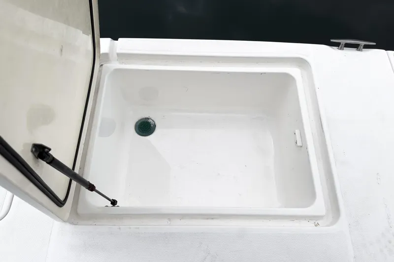 Slide: The Image of Open storage compartment on a 2006 Cruisers 415 boat deck. - 40