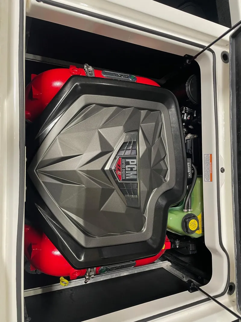 Slide: The Image of 2022 Nautique Super Air Nautique GS22 engine compartment with PCM engine cover. - 16