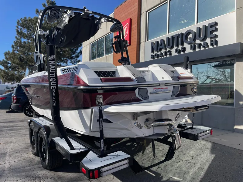 Slide: The Image of 2022 Nautique Super Air Nautique GS22 boat on trailer outside dealership. - 4