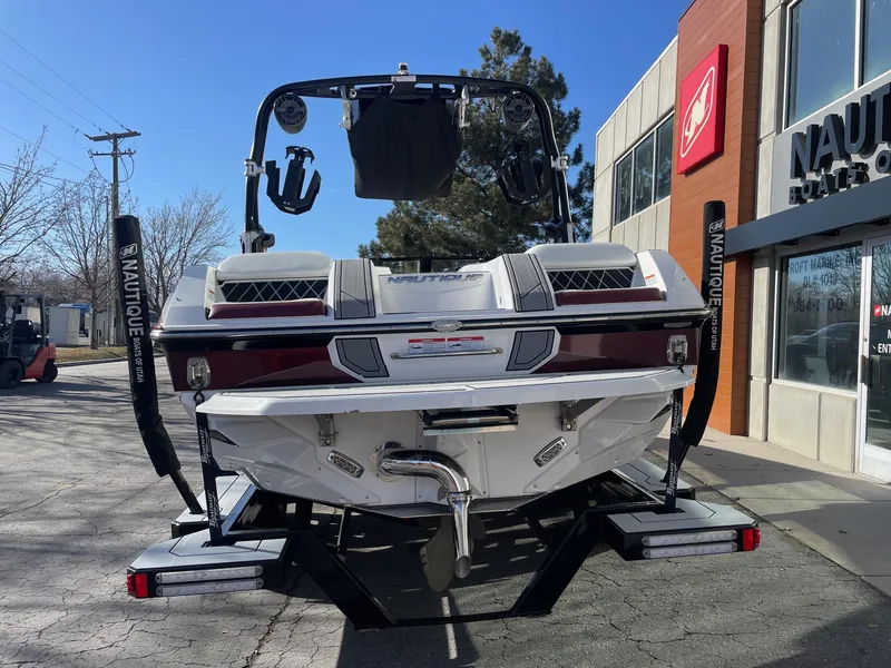 Slide: The Image of 2022 Nautique Super Air Nautique GS22 boat displayed outside dealership. - 5