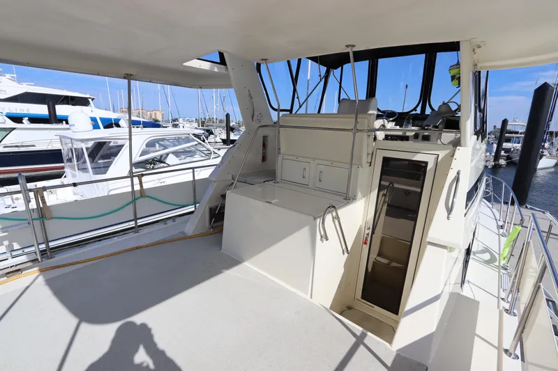 Slide: The Image of 1990 Hatteras 40 Double Cabin yacht interior with marina view. - 14