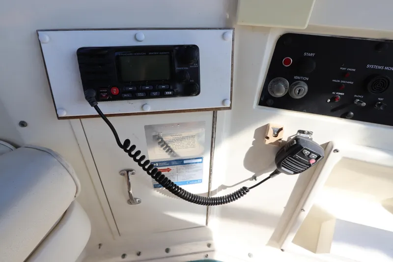 Slide: The Image of Control panel of a 1990 Hatteras 40 Double Cabin with radio and microphone. - 24