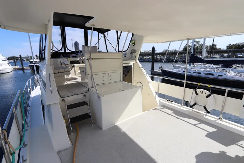 Slide: The Image of 1990 Hatteras 40 Double Cabin yacht interior with helm and seating area. - 29