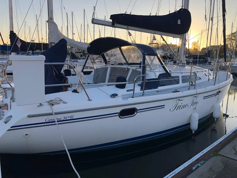 Slide: The Image of 2006 Catalina 36 MkII sailboat docked at marina during sunset. - 10