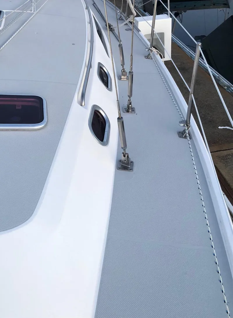 Slide: The Image of 2006 Catalina 36 MkII sailboat deck with sleek design and sturdy railings. - 15