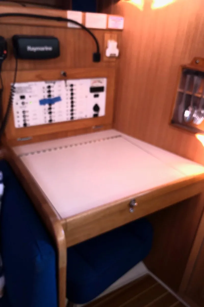 Slide: The Image of Navigation station inside 2006 Catalina 36 MkII sailboat with control panel and chart table. - 5