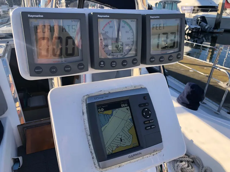 Slide: The Image of Sailing instruments on a 2006 Catalina 36 MkII, featuring Raymarine and Garmin displays. - 9