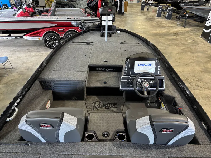 Slide: The Image of 2025 Ranger ALPHA 208 boat interior with steering console and seating. - 10