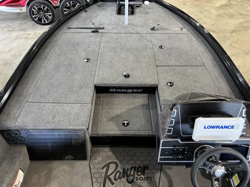 Slide: The Image of 2025 Ranger ALPHA 208 boat interior with Lowrance system and carpeted deck. - 12