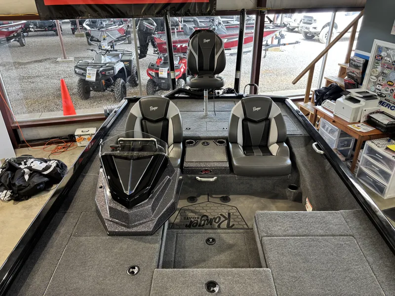 Slide: The Image of 2025 Ranger ALPHA 208 boat interior with gray seating and modern dashboard. - 14
