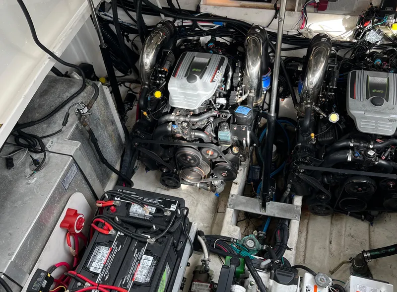 Slide: The Image of Engine compartment of 2014 Sea Ray 330 Sundancer with dual engines and batteries. - 2