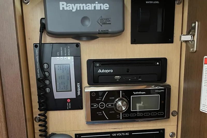 Slide: The Image of Control panel of a 2014 Sea Ray 330 Sundancer with Raymarine and Autopro equipment. - 22