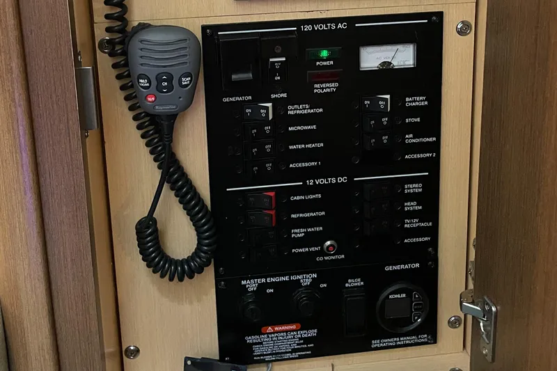 Slide: The Image of Control panel of a 2014 Sea Ray 330 Sundancer boat with microphone. - 23