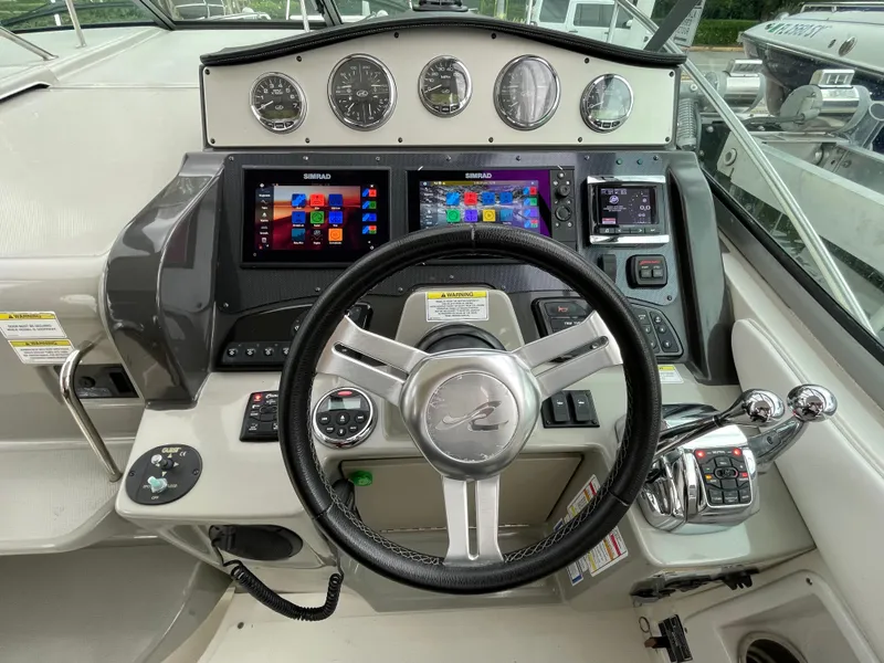 Slide: The Image of Control panel of 2014 Sea Ray 330 Sundancer boat with modern navigation displays. - 6
