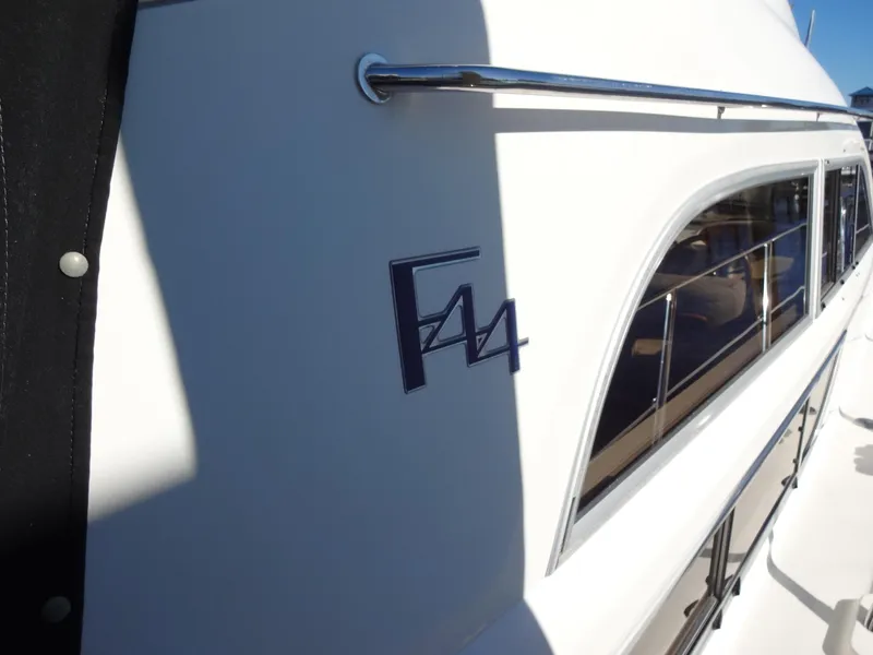 Slide: The Image of 1999 Sealine F44 yacht side view with logo and windows. - 11