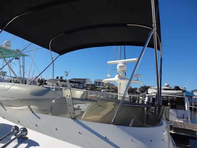 Slide: The Image of 1999 Sealine F44 yacht docked at marina under clear blue sky. - 18