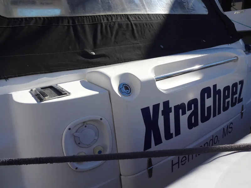 Slide: The Image of 1999 Sealine F44 boat with "XtraCheez" name, black cover, docked in Hernando, MS. - 20