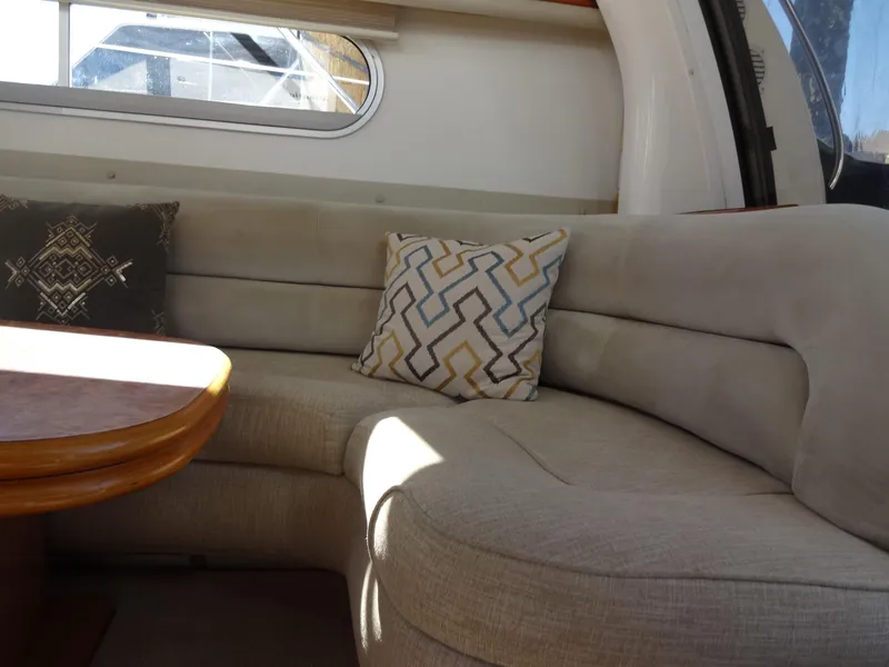 Slide: The Image of Interior of 1999 Sealine F44 yacht with cozy seating and decorative pillows. - 25